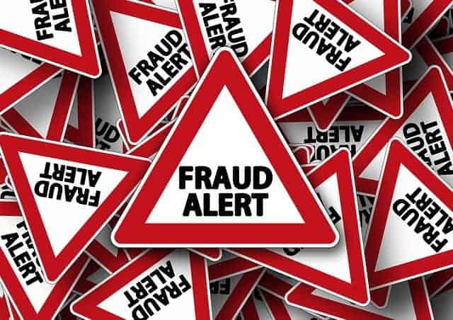 Triangular road signs with the warning Fraud Alert