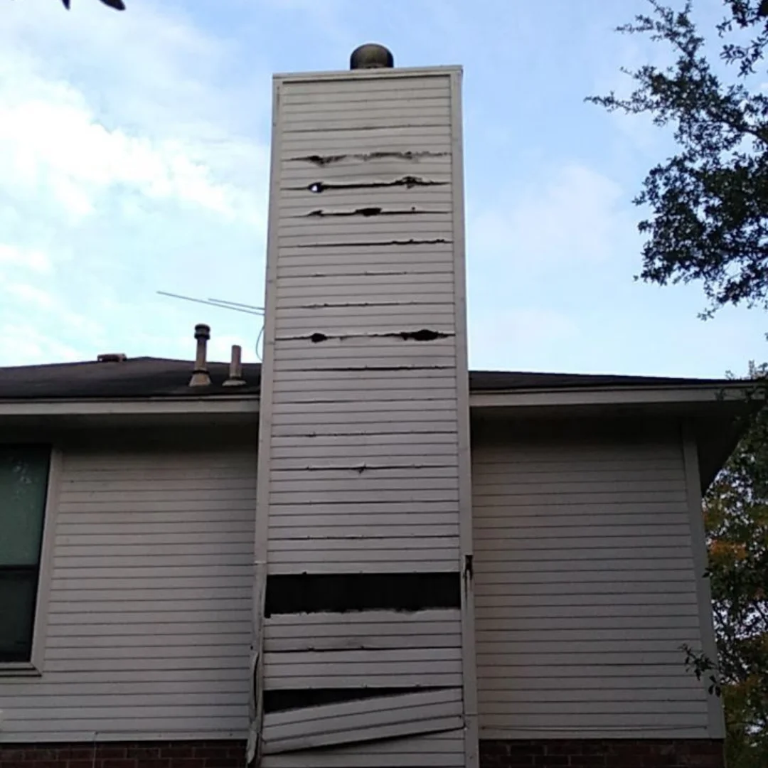 Before: Damaged siding