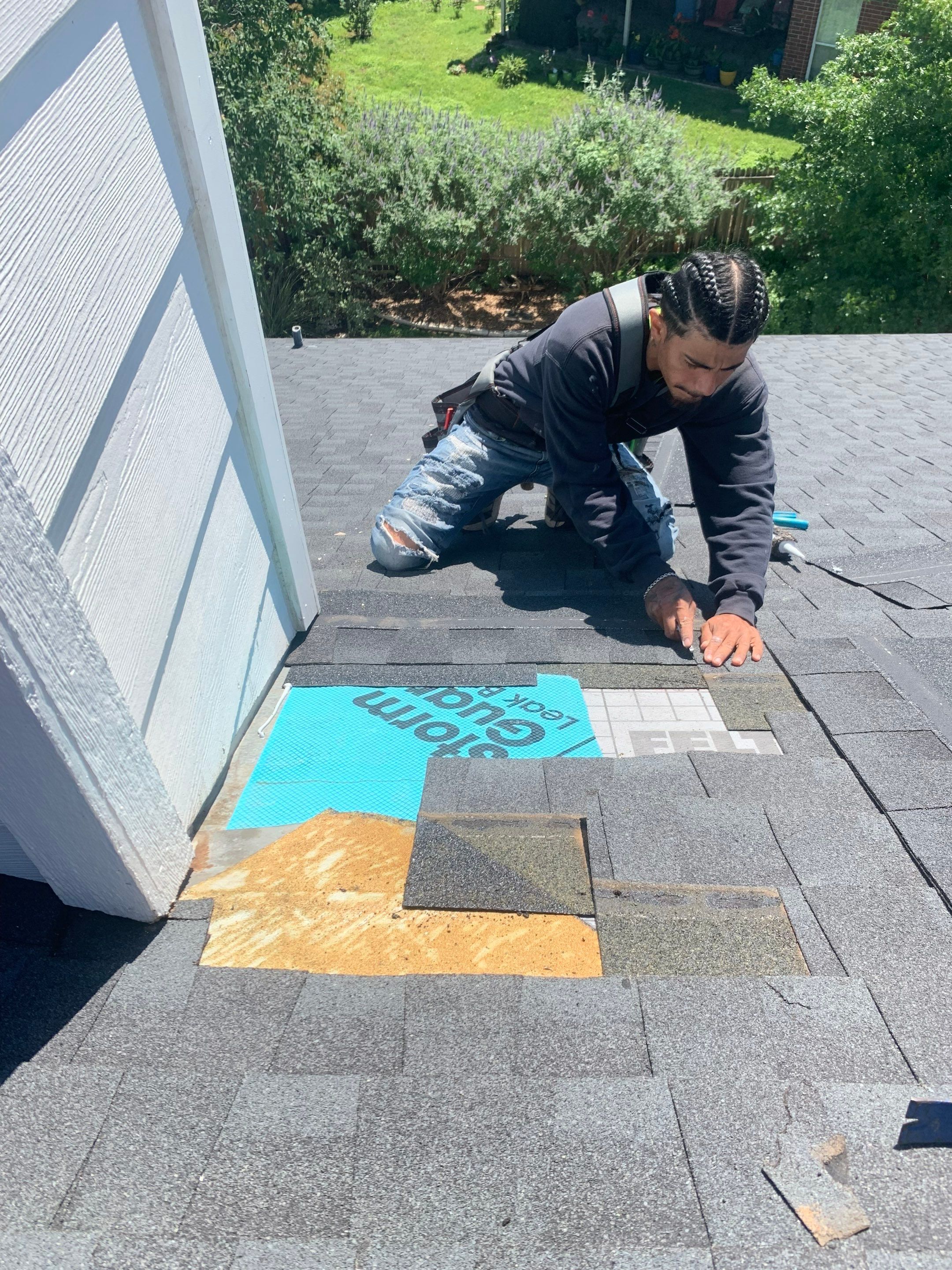 Roof repair in progress by Divided Sky Roofing