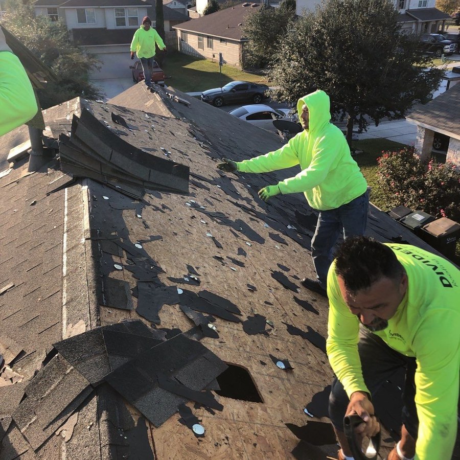Divided Sky crew working on a roof
