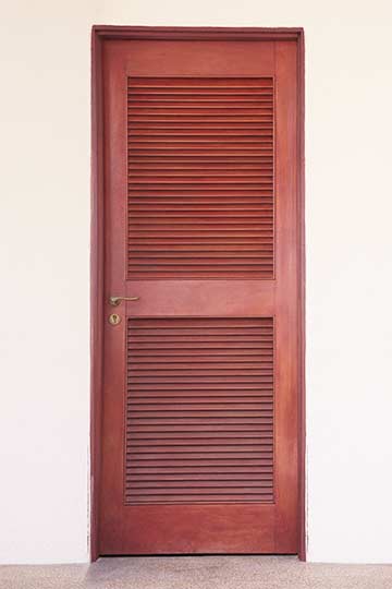 A red louvered door