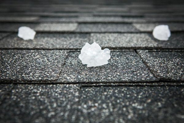 Roof with hail undergoing a roof inspection in Buda TX