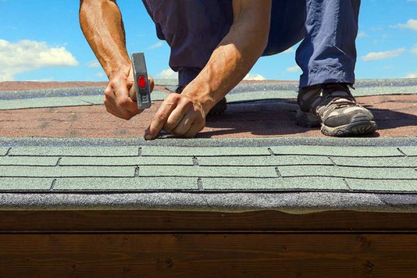 Asphalt shingle roof installation in progress