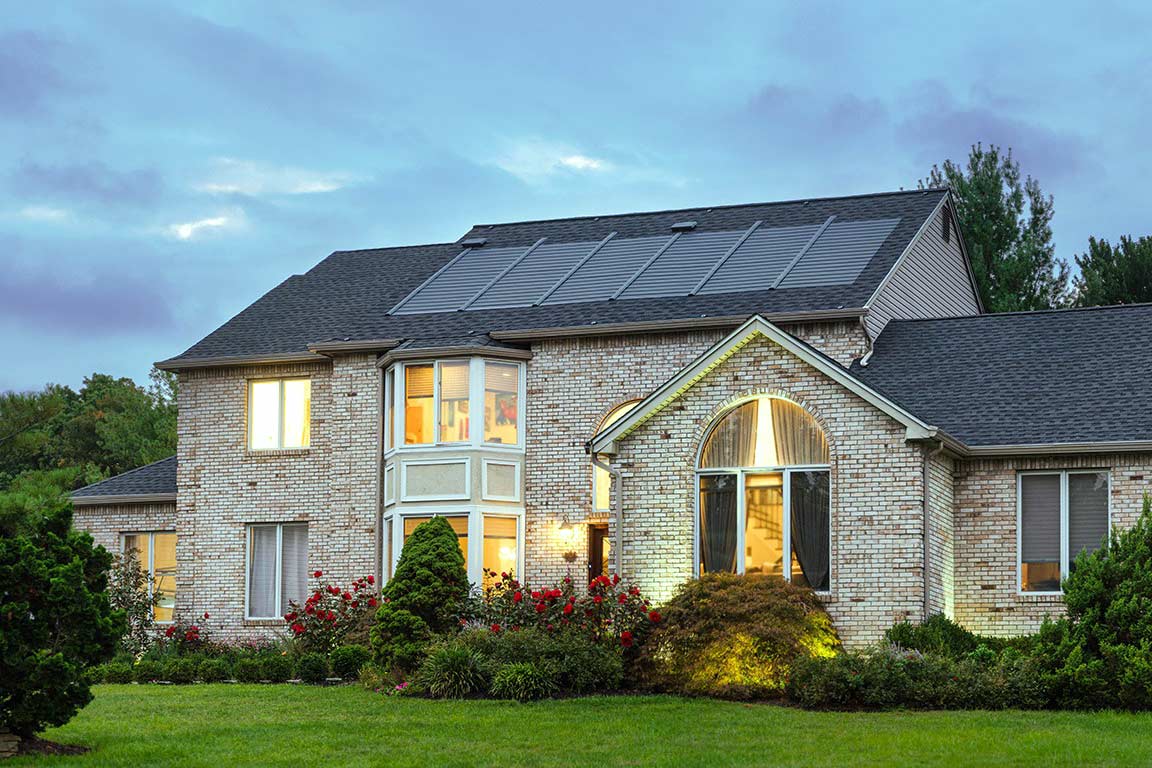 Home with solar roof shingles