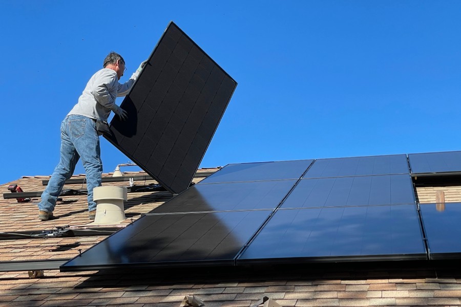 installing solar panels on a roof