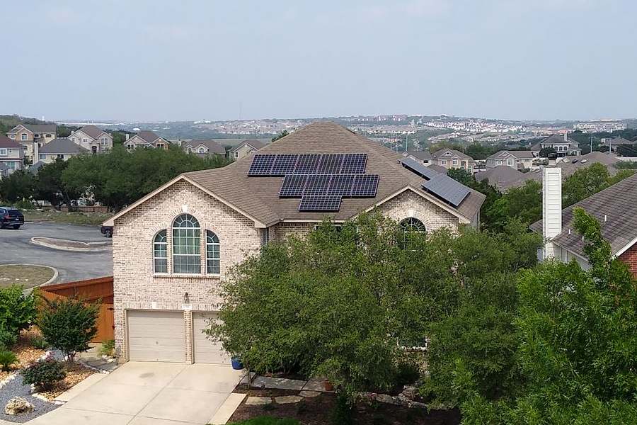 Rack mounted solar panels on a house roof