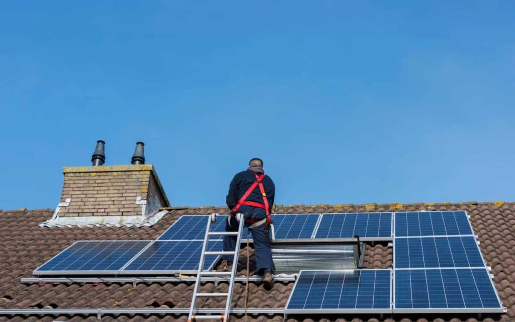 Austin Roofers installing solar panels on a residential roof.