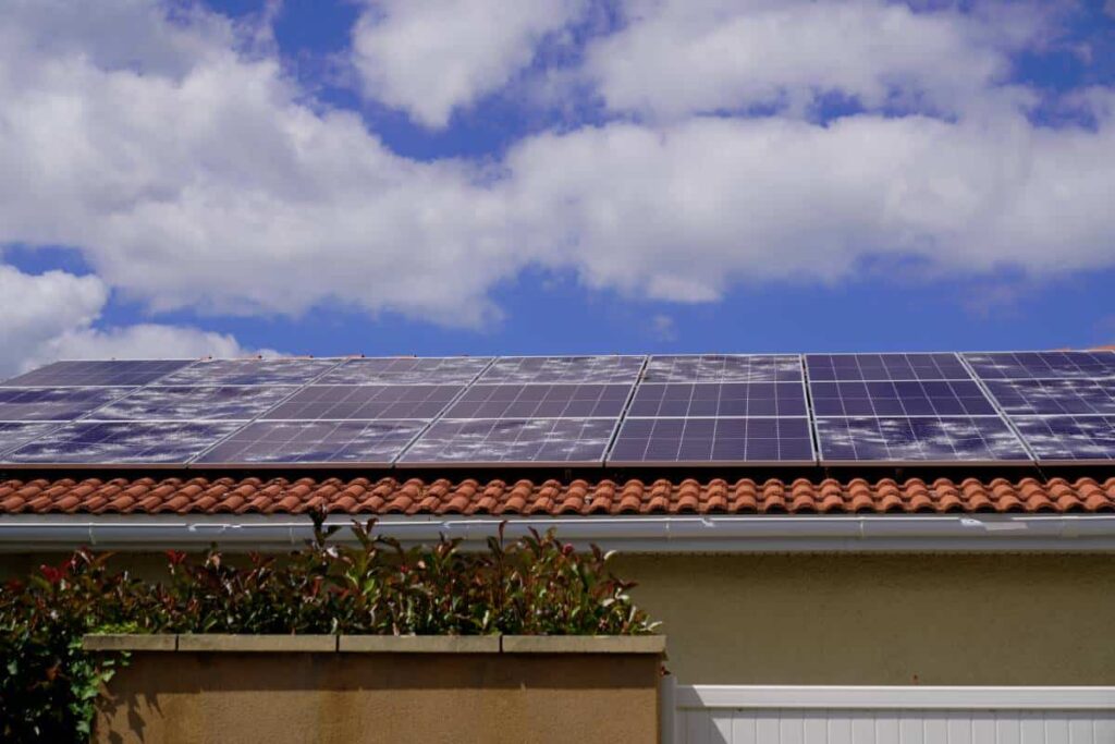 Solar panels being installed by San Marcos Roofers on a sunny day.