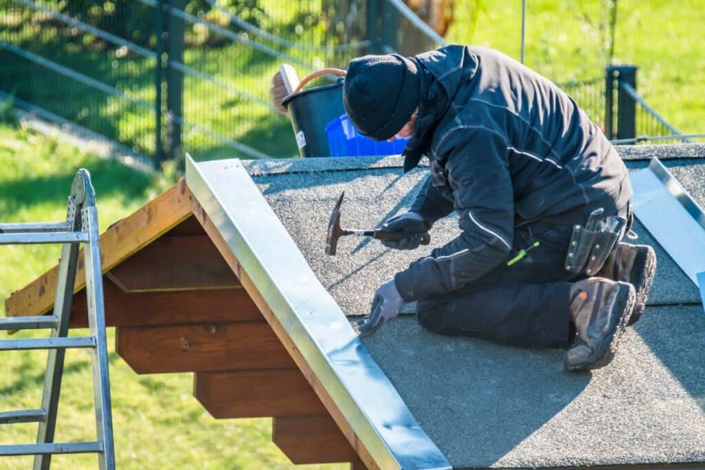 man doing some storm damage roof repair in San Marcos